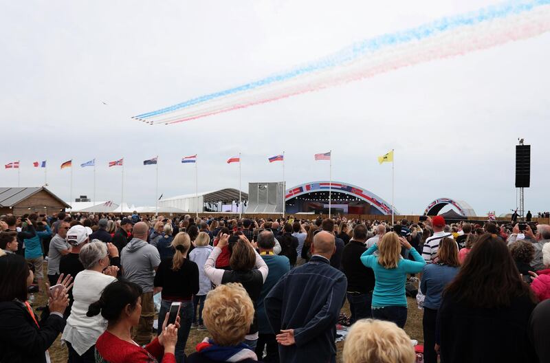 Members of the public watch a fly past during an event to commemorate the 75th anniversary of the D-Day landings, in Portsmouth.  AFP