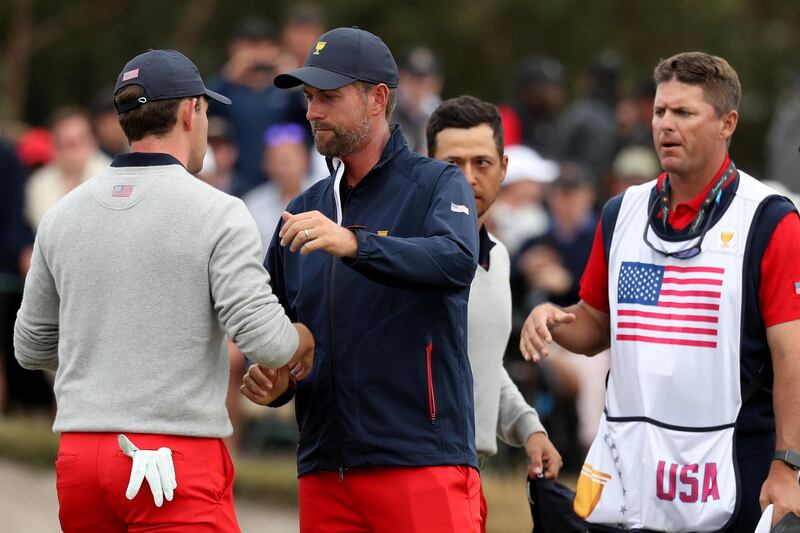 Xander Schauffele  and Patrick Cantlay of the United States team celebrate with Webb Simpson after defeating Cameron Smith and Sungjae Im of South Korea  2&1 during Saturday afternoon foursomes. Getty