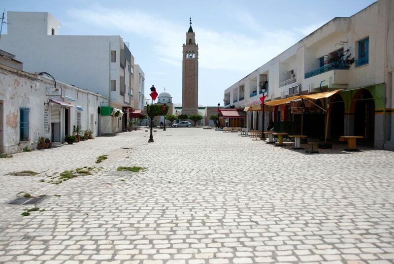 La Marsa district, just outside Tunis, is deserted Monday, May, 10, 2021. Tunisia announced on Friday strict new measures to try to contain the spread of the coronavirus, with the prime minister saying that the health system risks collapsing if something is not done. Houses of prayer are being ordered closed starting Sunday for a week, along with outdoor markets and large stores and malls. Shops selling food can remain open. (AP Photo/Hassene Dridi)