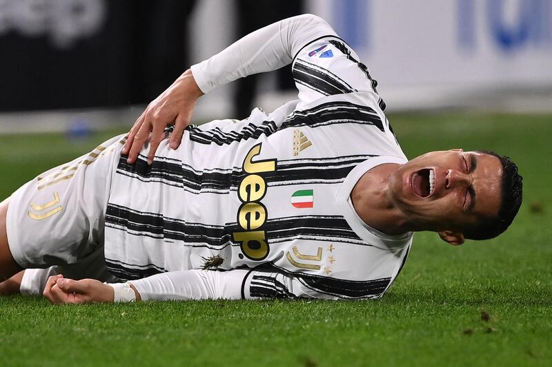Juve's Cristiano Ronaldo reacts to a Milan tackle. AFP