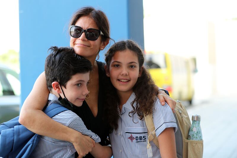 Parents drop off their children at Dubai British School after the long summer break. Chris Whiteoak / The National