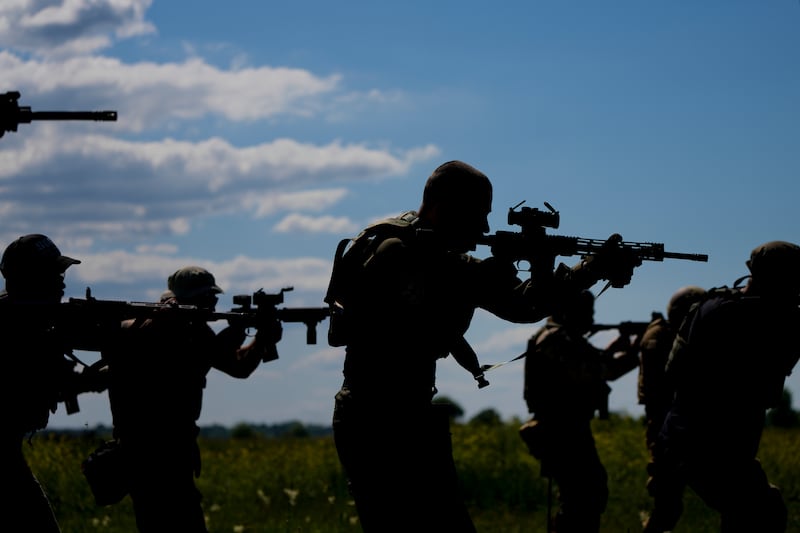Civilian militia men hold shotguns during training at a shooting range on the outskirts of Kyiv, Ukraine. AFP