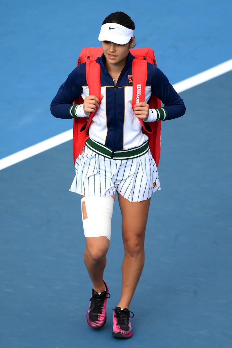 Emma Raducanu of Great Britain arrives for the match wearing heavy strapping on her thigh. Getty Images