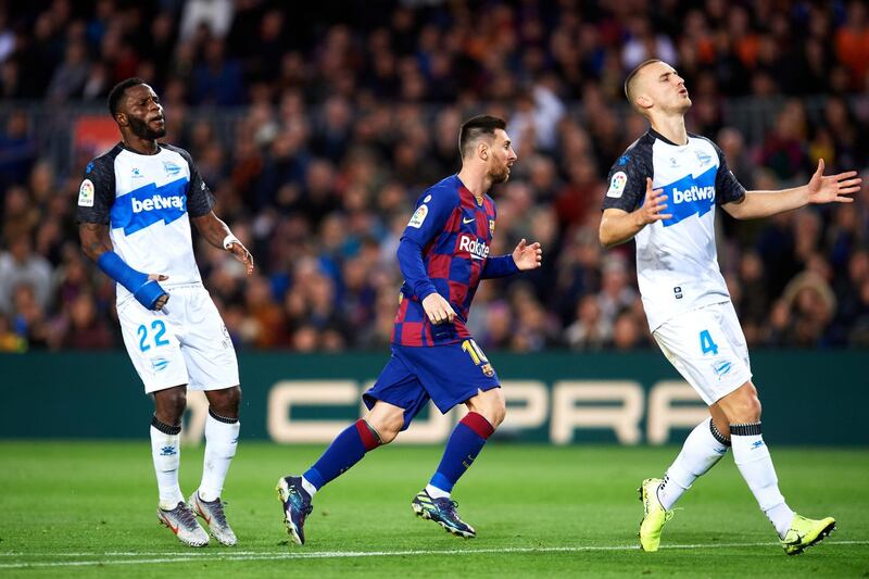 Messi  celebrates scoring his team's third goal during the La Liga match against Deportivo Alaves in December. Getty