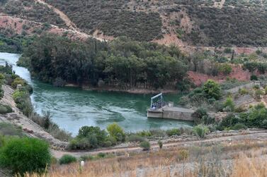 A picture taken on October 13, 2021 shows a view of the Medjerda river flowing through the Sidi Salem dam in the northern Tunisian area of Testour, in the Beja province.  - The Sidi Salem reservoir supplies water to almost three million Tunisians, but years of drought across North Africa has left it critically low, an ominous sign for the region's future.  All four Maghreb states -- Tunisia, Libya, Algeria and Morocco -- are among the 30 most water-stressed countries in the world, according to the World Resources Institute.  And as droughts get longer and more intense in the coming years, farmers will be the first to feel the pinch.  (Photo by Fethi Belaid  /  AFP)