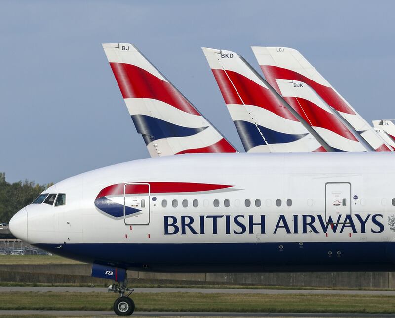 A British Airways plane at Heathrow Airport. The airline's revenue grew by 20 per cent in the third quarter. PA Images