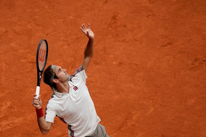 Federer serves against Nadal. AFP