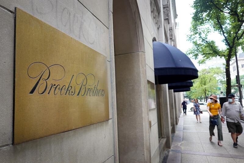 CHICAGO, ILLINOIS - JULY 08: The Brooks Brothers logo is engraved on a plaque in front of a closed store along the Magnificent Mile on July 08, 2020 in Chicago, Illinois. The retailer which was founded in 1818 and currently has more than 500 stores worldwide filed for bankruptcy protection today.   Scott Olson/Getty Images/AFP
== FOR NEWSPAPERS, INTERNET, TELCOS & TELEVISION USE ONLY ==
