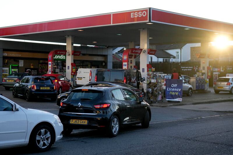 Drivers queue for fuel at a petrol station in London on Wednesday morning amid the ongoing fuel crisis. Prime Minister Boris Johnson said disruption to the supply chain could continue for months. Photo: AP
