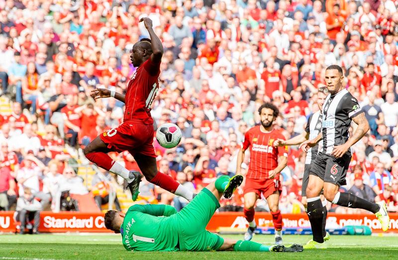 Newcastle goalkeeper Martin Dubravka spills the ball to allow Liverpool's Sadio Mane to score his second goal of the afternoon. AFP