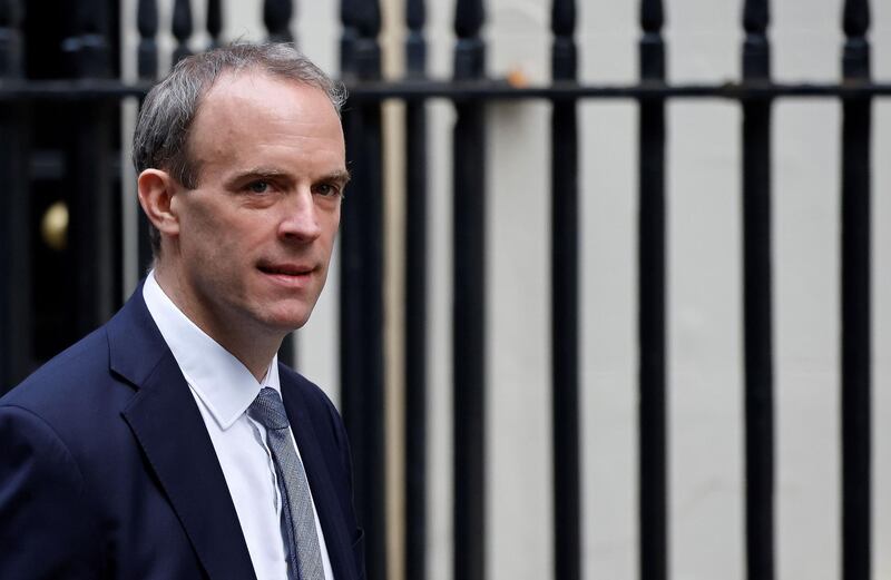 Britain's Foreign Secretary Dominic Raab arrives at 10 Downing Street in central London on November 26, 2020. Britain's government on Wednesday unveiled plans to slash the foreign aid budget to help mend its coronavirus-battered finances, prompting one minister to quit and defying impassioned calls to protect the world's poorest people. / AFP / Tolga Akmen
