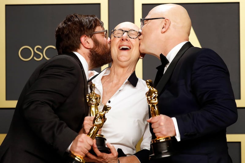 Jeff Reichert, Julia Reichert, and Steven Bognar pose in the press room with the Oscar for Best Documentary Feature for 'American Factory' at the 92nd Academy Awards on Sunday, February 9. AFP