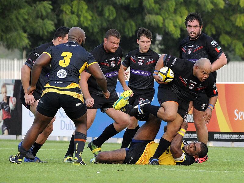 Dubai Hurricanes, in grey and yellow, were denied the chance of a final against Exiles in the UAE Premiership, after it was ruled league placings would decide the title-winners. Courtesy Dubai Exiles