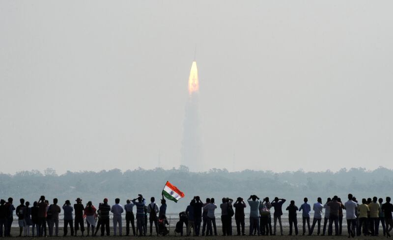 Indian onlookers watch the launch of the Indian Space Research Organisation (ISRO) Polar Satellite Launch Vehicle (PSLV-C37) at Sriharikota in 2018. AFP