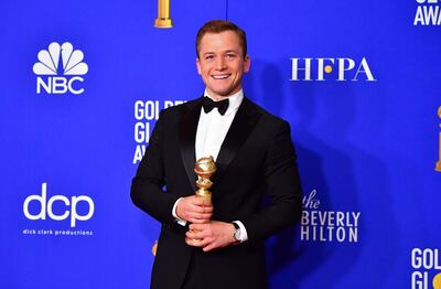 Actor Taron Egerton poses in the press room with the award for best Best Performance by an Actor in a Motion Picture - Musical or Comedy during the 77th annual Golden Globe Awards on January 5, 2020, at The Beverly Hilton hotel in Beverly Hills, California. / AFP / FREDERIC J. BROWN

