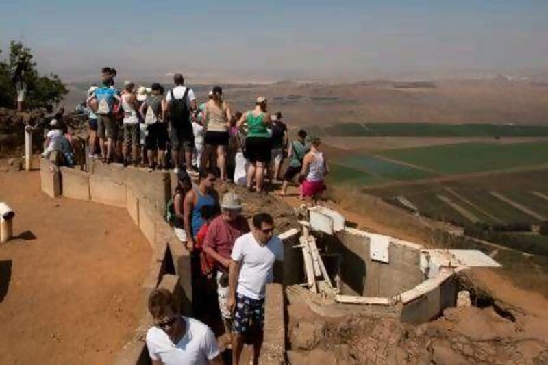 Israeli tourists gather at the Mount Bental army post lookout from the 1967 war in the Golan Heights, which overlooks Syria.