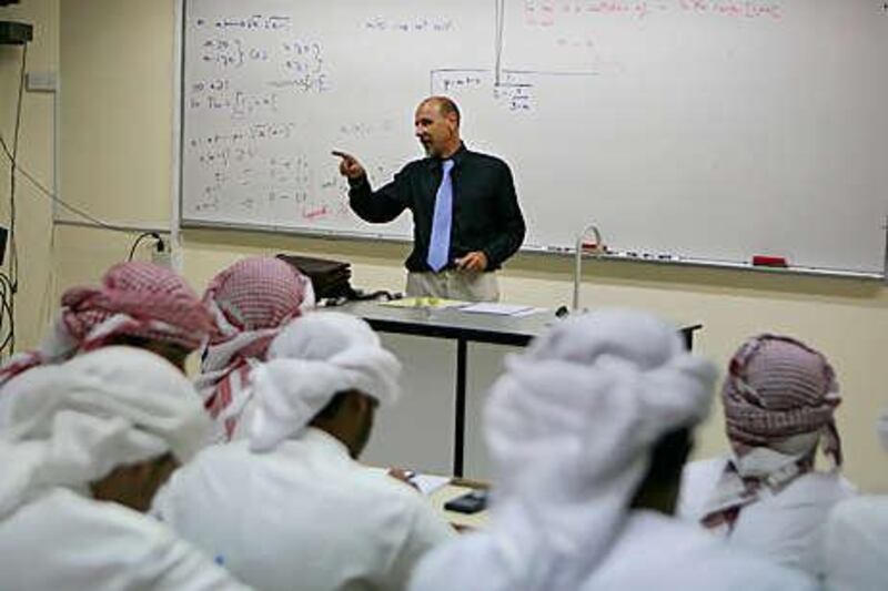 A teacher at Al Ittihad Model School leads students in a maths lesson.
