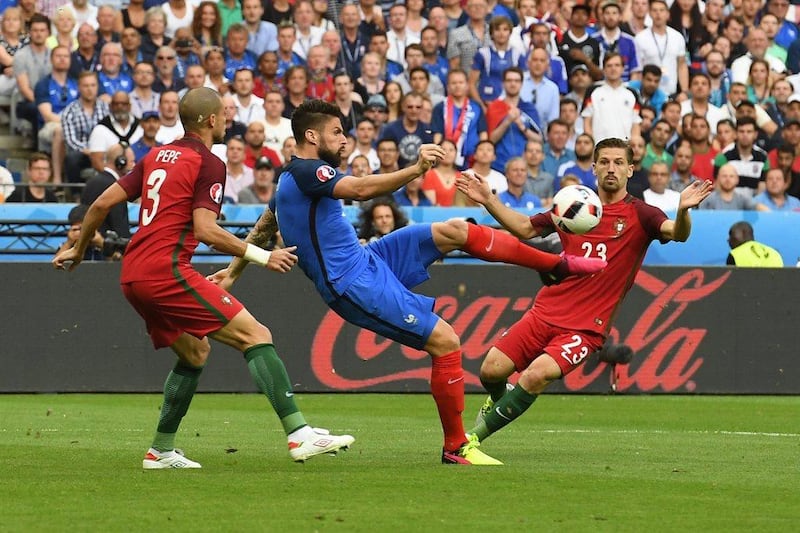 Olivier Giroud (C) of France in action against Pepe (L) and Adrien Silva of Portugal during the Uefa Euro 2016 Final match between Portugal and France at Stade de France in Saint-Denis, France, 10 July 2016. Georgi Licovski / EPA