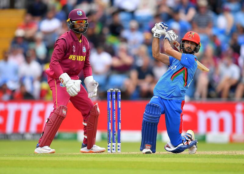 LEEDS, ENGLAND - JULY 04: Ikram Ali Khil of Afghanistan in action batting as Shai Hope of West Indies looks on during the Group Stage match of the ICC Cricket World Cup 2019 between Afghanistan and West Indies at Headingley on July 04, 2019 in Leeds, England. (Photo by Clive Mason/Getty Images)