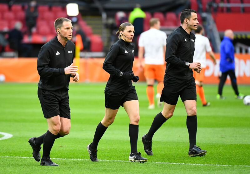 Referee Stephanie Frappart and her match officials before the match. Reuters