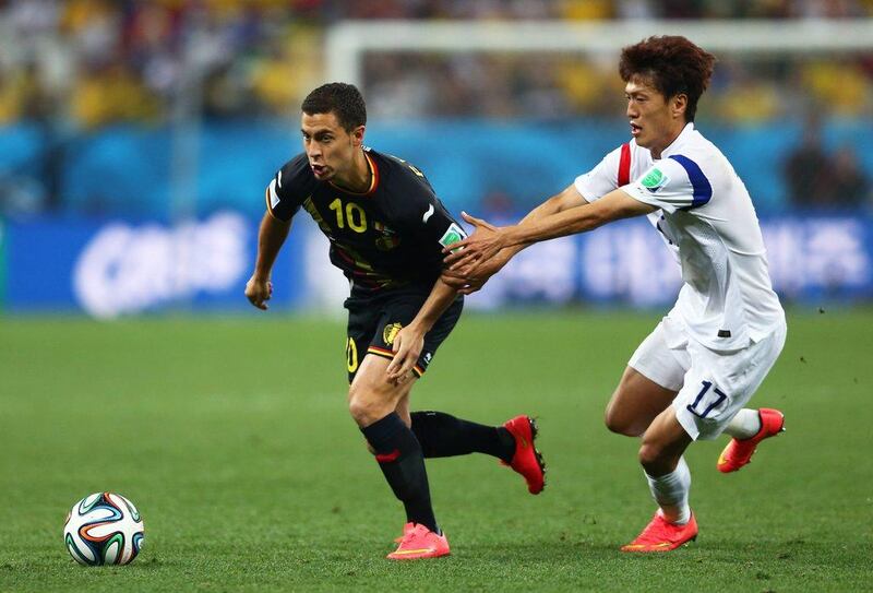 Eden Hazard of Belgium dribbles away from Lee Chung-Yong of South Korea during their match on Thursday at the 2014 World Cup in Sao Paulo, Brazil. Clive Brunskill / Getty Images