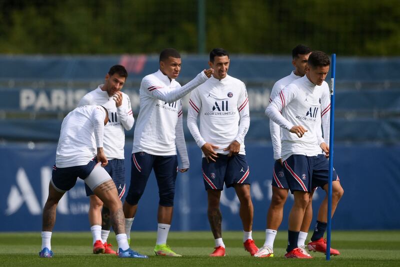 Lionel Messi and his new team-mates in training. AFP