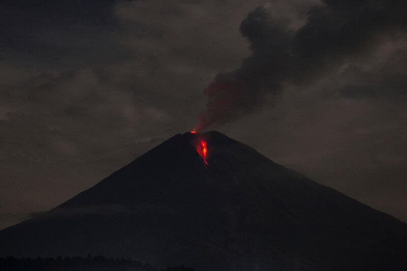 Lava streams down from Mount Semeru as seen from Lumajang, East Java, Indonesia.  EPA