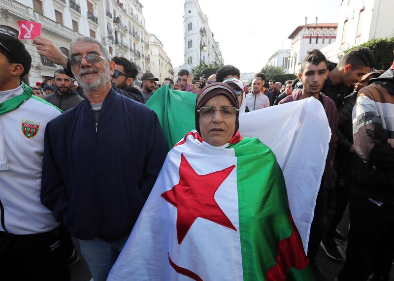 Algerians chant slogans during a protest rally in Algiers, Algeria. Thousands of people have taken to the streets in the capital Algiers calling for a mass boycott of the country's presidential elections, which is taking place on the day, and to voice against the five candidates running to replace ousted president Abdelaziz Bouteflika for being closely linked to the former regime.  EPA