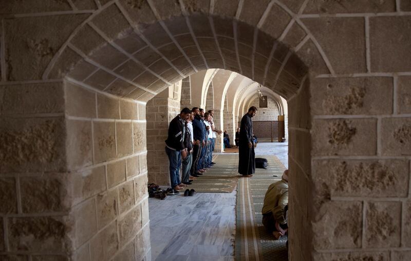 Palestinian Muslim worshipers pray at Al Omari mosque in Gaza City. AP Photo