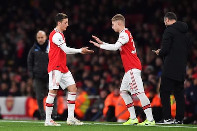 (FILES) In this file photo taken on December 15, 2019 Arsenal's German midfielder Mesut Ozil (L) is substituted for Arsenal's English midfielder Emile Smith Rowe (R) during the English Premier League football match between Arsenal and Manchester City at the Emirates Stadium in London.  Managers will be able to make up to five substitutions for the remainder of the 2019/20 Premier League season after clubs agreed to the temporary rule change at a meeting on Thursday, June 4. - RESTRICTED TO EDITORIAL USE. No use with unauthorized audio, video, data, fixture lists, club/league logos or 'live' services. Online in-match use limited to 120 images. An additional 40 images may be used in extra time. No video emulation. Social media in-match use limited to 120 images. An additional 40 images may be used in extra time. No use in betting publications, games or single club/league/player publications.
 / AFP / Ben STANSALL / RESTRICTED TO EDITORIAL USE. No use with unauthorized audio, video, data, fixture lists, club/league logos or 'live' services. Online in-match use limited to 120 images. An additional 40 images may be used in extra time. No video emulation. Social media in-match use limited to 120 images. An additional 40 images may be used in extra time. No use in betting publications, games or single club/league/player publications.
