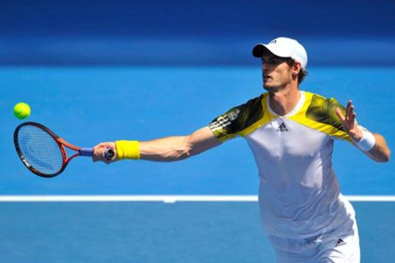 Andy Murray hits a return to Joao Sousa during their Australian Open tie.