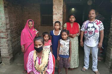 Jyoti Kumari, second from left, and her family stand in front of their house in Siruhully village at Darbhanga district, on May 23, 2020. A 15-year-old girl who cycled her ailing father 1,200 kilometres across India during a nationwide coronavirus lockdown has been offered a chance to break into the national cycling team. AFP