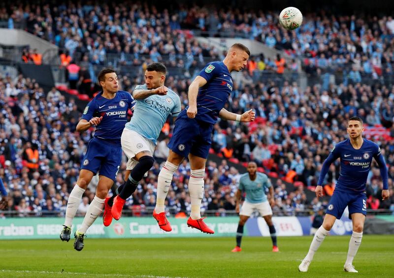 Chelsea's Ross Barkley and Azpilicueta in action with Manchester City's Nicolas Otamendi. Reuters