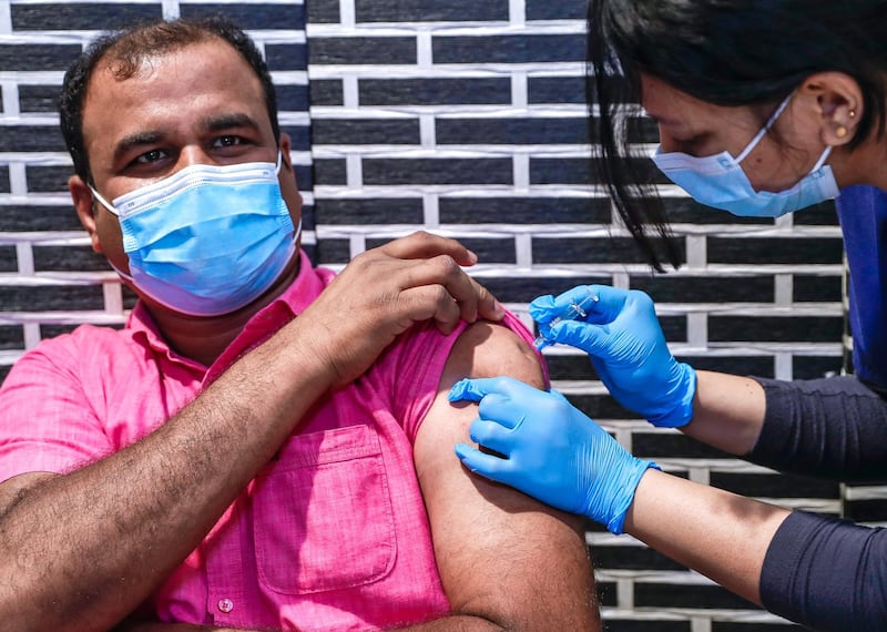 Abu Dhabi, United Arab Emirates, March 30, 2021.  Sulaiman Kalathul gets vaccinated at the  Biogenix Labs at G42 in Masdar City.  As of March 25, Biogenix Labs now administers the Sinopharm Covid vaccine.Victor Besa/The NationalSection:  NAReporter:  Shireena Al Nowais