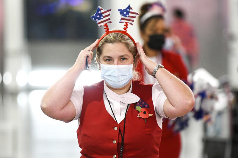 Virgin Atlantic staff at Heathrow prepare for the departures