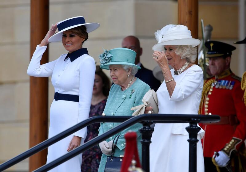 Britain's Queen Elizabeth II (C) stands with US First Lady Melania Trump (L) and Britain's Camilla, Duchess of Cornwall (R) during a welcome ceremony at Buckingham Palace in central London on June 3, 2019, on the first day of the US president and First Lady's three-day State Visit to the UK. Britain rolled out the red carpet for US President Donald Trump on June 3 as he arrived in Britain for a state visit already overshadowed by his outspoken remarks on Brexit. / AFP / POOL / TOBY MELVILLE
