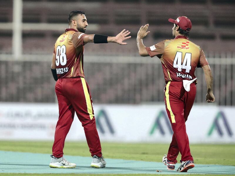 Sharjah, United Arab Emirates - October 06, 2018:Sayed Shirzad (L) of the Kandahar Knights celebrates the wicket of Johnson Charles of the Nangarhar Leopards during the game between Kandahar Knights and Nangarhar Leopards in the Afghanistan Premier League. Saturday, October 6th, 2018 at Sharjah Cricket Stadium, Sharjah. Chris Whiteoak / The National