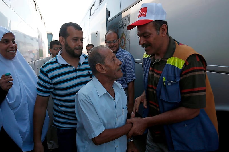 Palestinian Muslim pilgrims arrive at the Rafah border crossing between Egypt and the southern Gaza Strip, on August 4, 2018, ahead of their departure to the annual Hajj pilgrimage in Saudi Arabia's holy city of Makkah. AFP