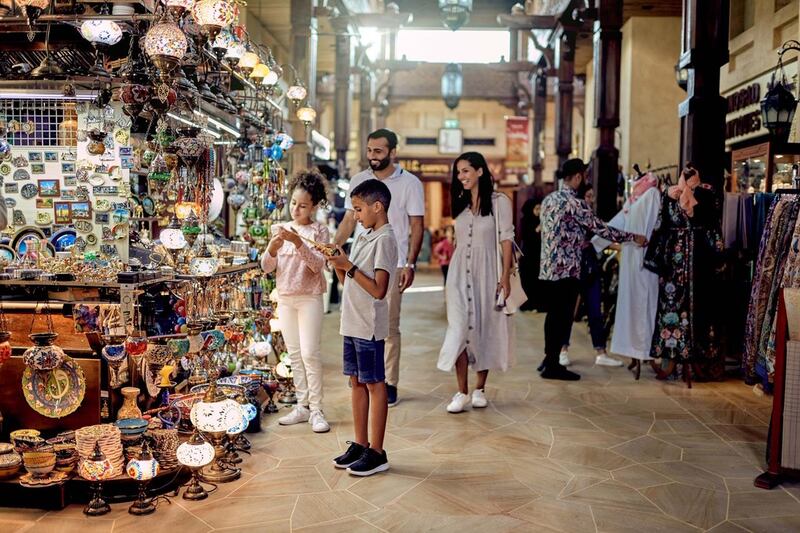 A family shops in one of Dubai's traditional souks. Courtesy Dubai Tourism