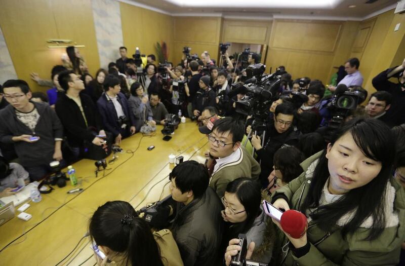 Journalists wait in a conference room for a news conference regarding the missing Malaysian Airlines. Reuters