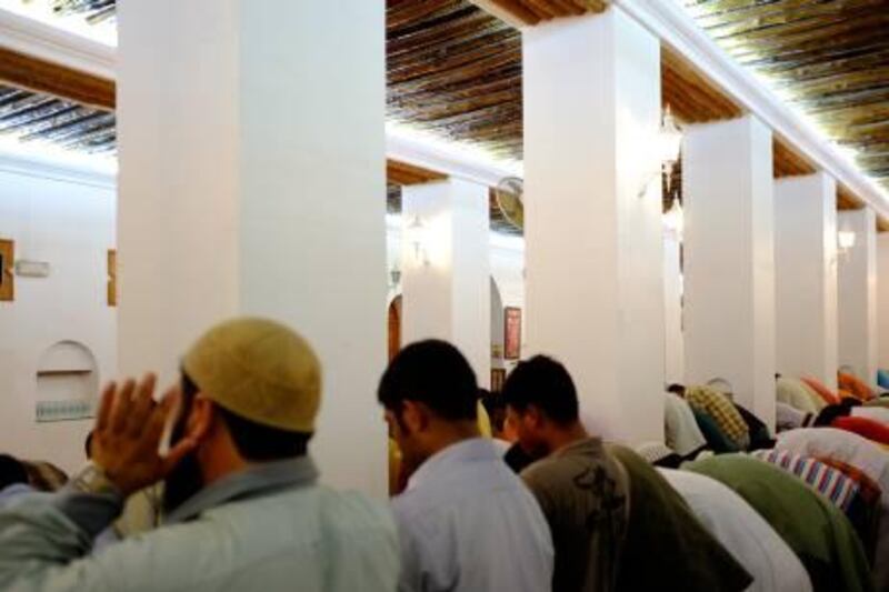 August 14. Worshippers pray the first evening prayer at the Sheikh Mohammed Bin Salem Al Qassimi mosque in old Ras Al Khaimah. August 14, Ras Al Khaimah. United Arab Emirates (Photo: Antonie Robertson/The National)