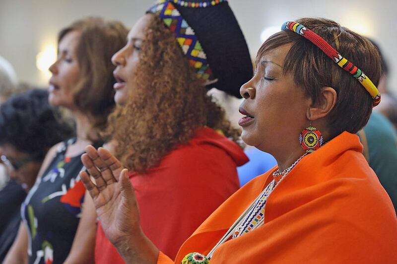 Pumla Mbana, right, was among those attending a public memorial for Nelson Mandela, held at the Evangelical Community Church in remembrance and honour of South Africa's former president. Delores Johnson / The National