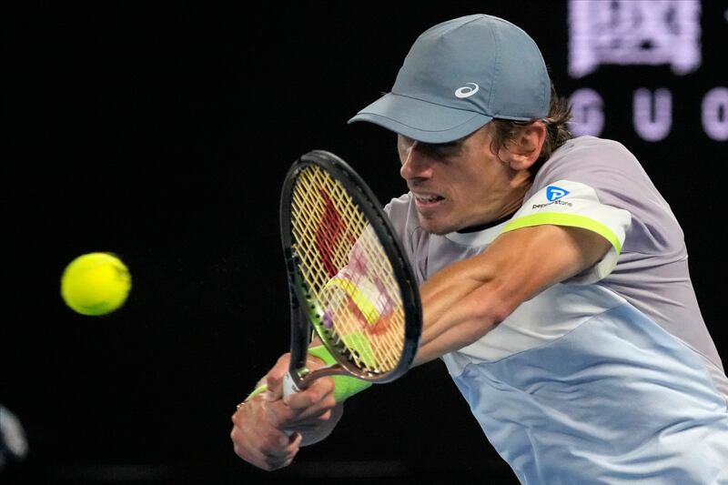 Alex de Minaur of Australia returns to Novak Djokovic of Serbia. AP