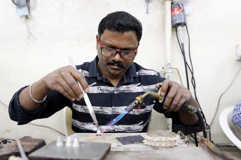 SHARJAH , UNITED ARAB EMIRATES , OCT 24   – 2017 :- Surenderan K from Kerala , India making silver jewellery at the Al Baroon silver shop in the Al Mareija area near the Heritage area in Sharjah. He is working in this shop for the last 15 years. (Pawan Singh / The National) For Weekend