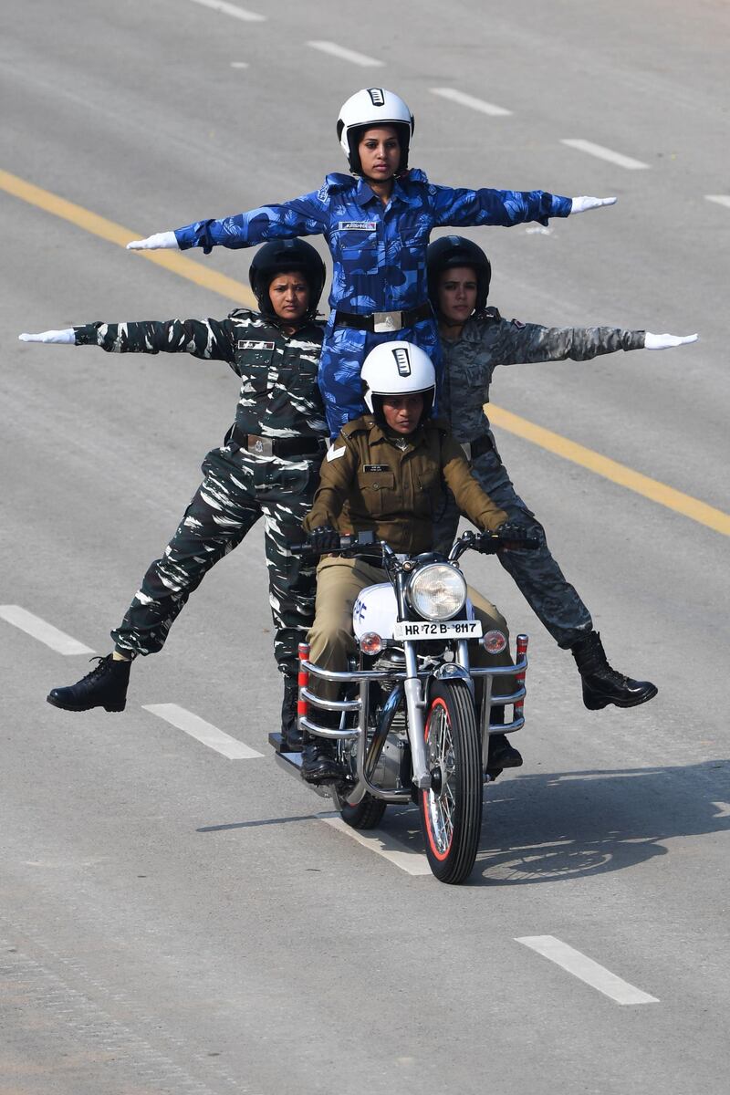 Women officers from the Central Reserve Police Force's motorcycle team perform during the Republic Day parade in New Delhi. AFP