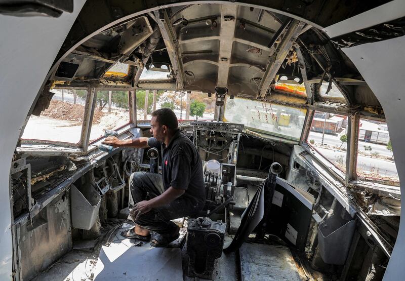 A technician drills holes in the cockpit of the aircraft in Nablus in the occupied West Bank.  The plane was bought by the twins, former scrap metal traders, for $100,000 from an Israeli in Kiryat Shmona, northern Israel.