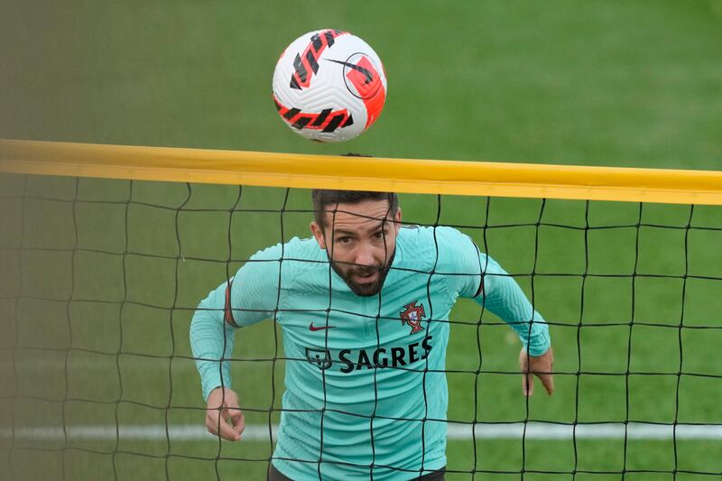 Portugal's Joao Moutinho heads a ball during a training session in Oeiras. AP