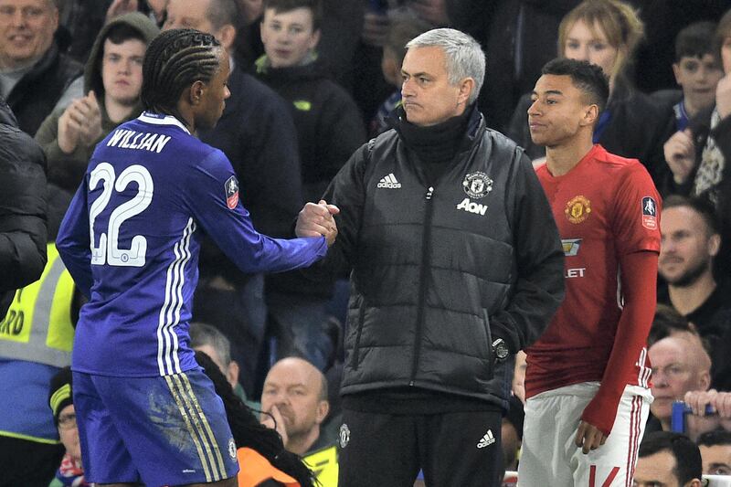 Manchester United's Portuguese manager Jose Mourinho (C) gestures to Chelsea's Brazilian midfielder Willian as he comes off during the English FA Cup quarter final football match between Chelsea and Manchester United at Stamford Bridge in London on March 13, 2017. / AFP PHOTO / Glyn KIRK / RESTRICTED TO EDITORIAL USE. No use with unauthorized audio, video, data, fixture lists, club/league logos or 'live' services. Online in-match use limited to 75 images, no video emulation. No use in betting, games or single club/league/player publications.  / 