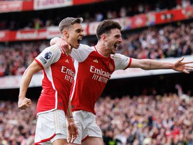 Leandro Trossard of Arsenal (C) celebrates with Declan Rice (R) after scoring 2-0 goal during the English Premier League soccer match of Arsenal FC against AFC Bournemouth, in London, Britain, 04 May 2024.   EPA/TOLGA AKMEN EDITORIAL USE ONLY.  No use with unauthorized audio, video, data, fixture lists, club/league logos, 'live' services or NFTs.  Online in-match use limited to 120 images, no video emulation.  No use in betting, games or single club/league/player publications. 