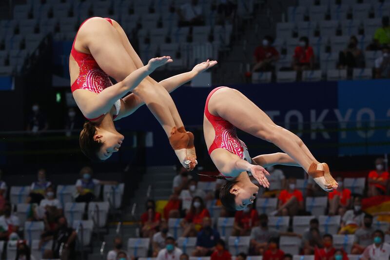 Shi Tingmao and Wang Han of China claim gold in the Women's 3m Springboard Synchro.